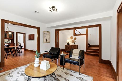 Step into a completely renovated living room where timeless charm meets modern convenience. Refinished hardwood floors, abundant natural light.