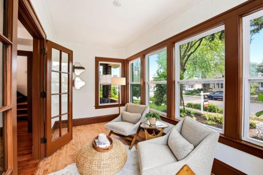 Lovingly restored with meticulous attention to detail, this inviting four-season porch offers endless possibilities. Whether you envision a home office, creative studio, study, or cozy sitting area, this flexible space is ready to fit your lifestyle.