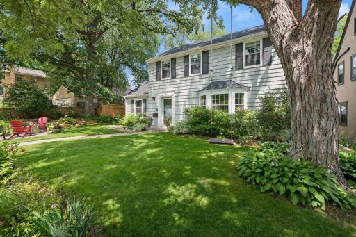 Timeless two-story Colonial with extensive updates on an oversized, professionally landscaped lot in desirable Tangletown.