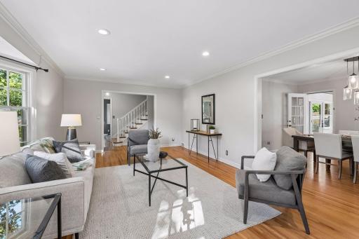 Cozy living room with newer gas fireplace & refinished hardwood floors.