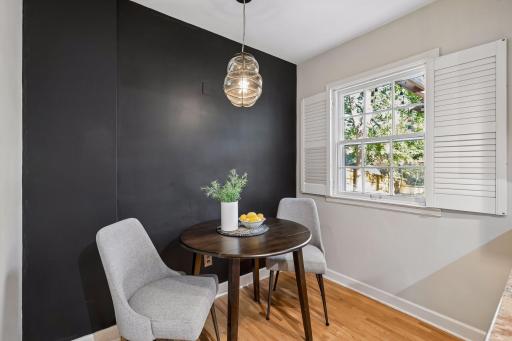 Eat-in kitchen with peninsula, granite countertops & stainless appliances.