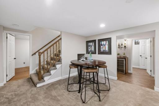 Beautifully remodeled basement features a wet bar, an additional full bathroom, a spacious family room, and another flexible space that works as an office, workout room, or nonconforming 5th bedroom.