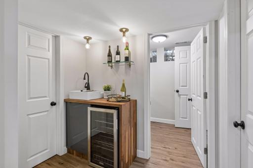 Beautifully remodeled basement features a wet bar, an additional full bathroom, a spacious family room, and another flexible space that works as an office, workout room, or nonconforming 5th bedroom.