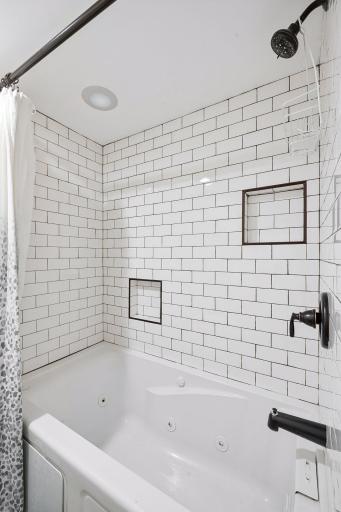 Basement full bathroom features full tub & shower space.