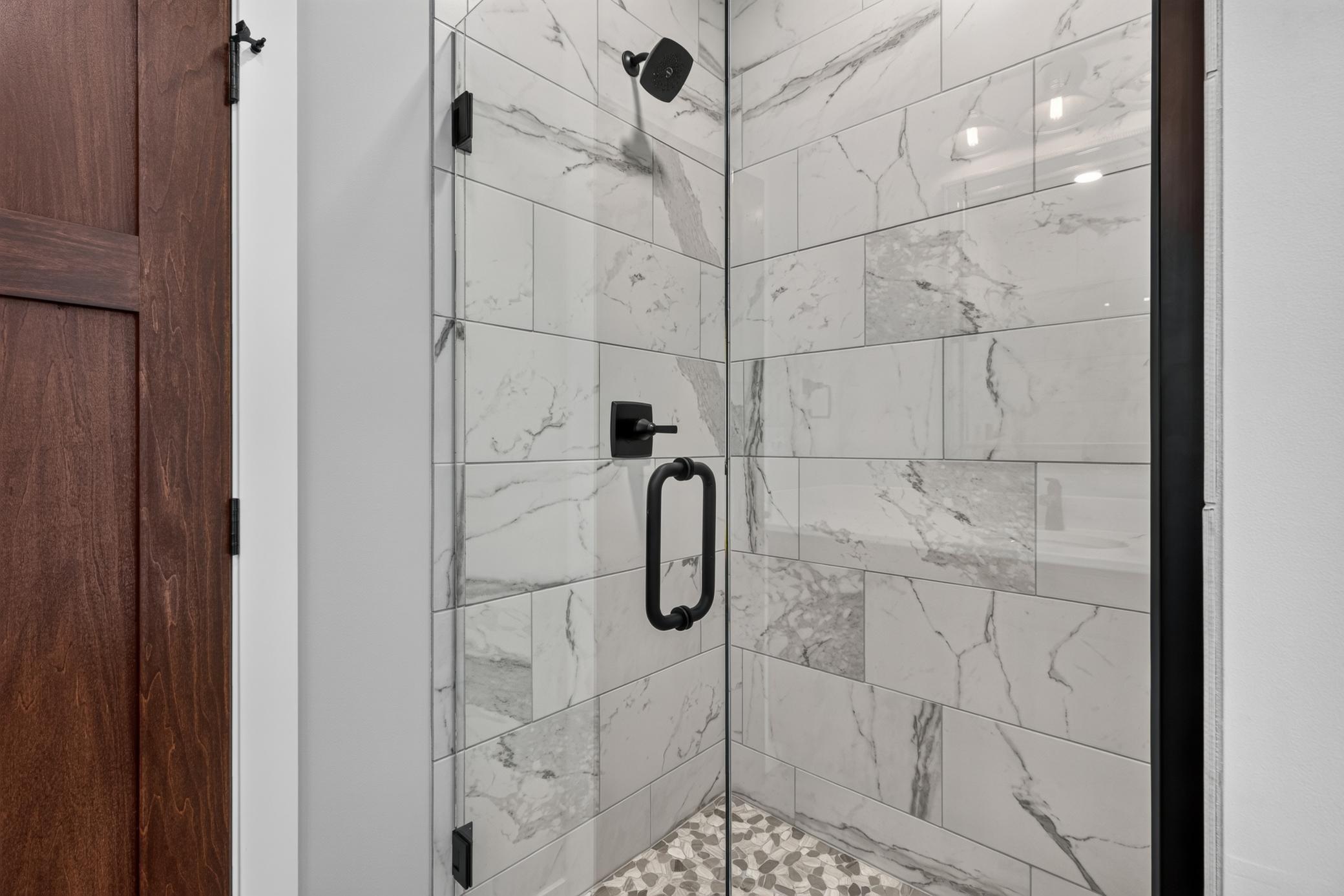 Beautiful tiled shower with glass door