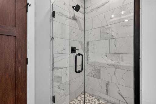 Beautiful tiled shower with glass door