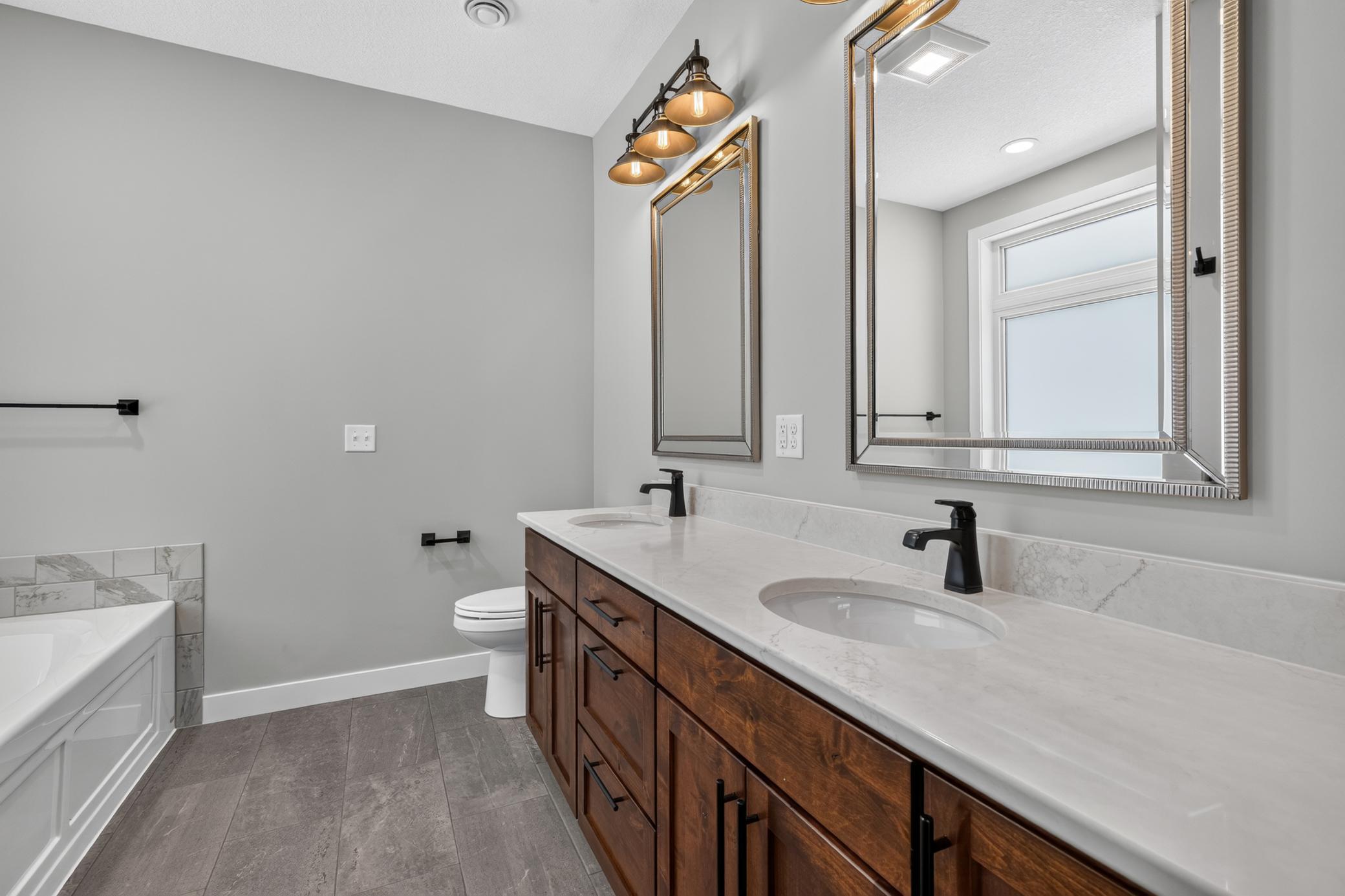 Custom Knotty Alder Cabinetry with Quartz countertop