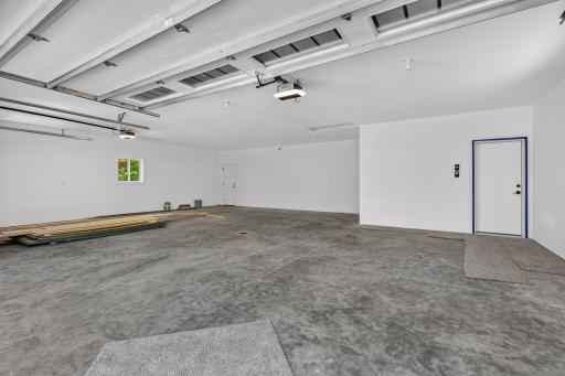 The attached heated and insulated 3 stall garage has abundant storage, floor drain, and 2 large pulldown storage areas