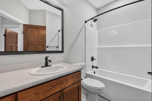 Full bathroom featuring custom Knotty Alder Cabinetry