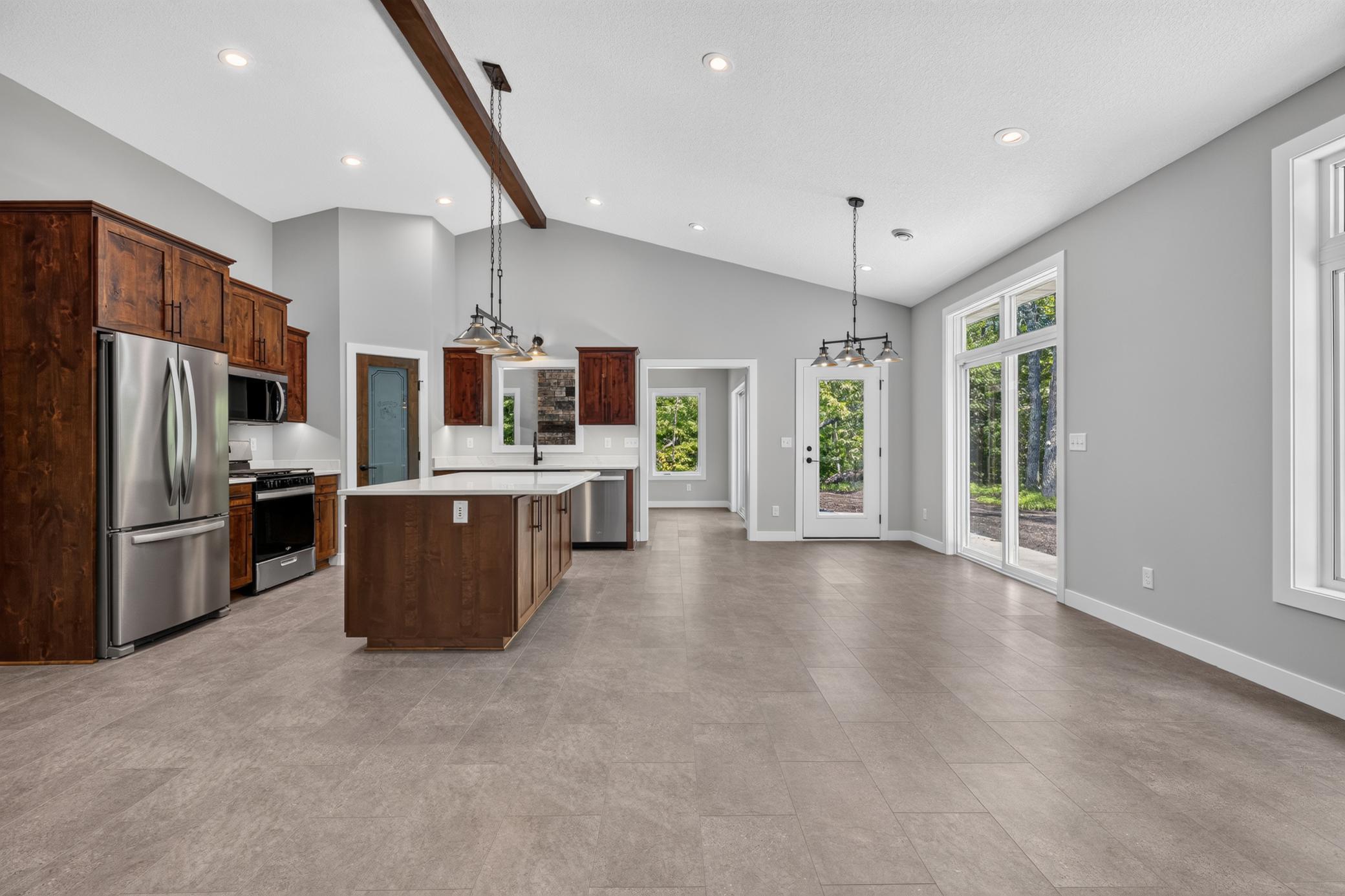 The open kitchen and dining room flows right into the Four Season Porch