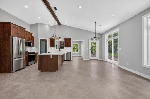The open kitchen and dining room flows right into the Four Season Porch