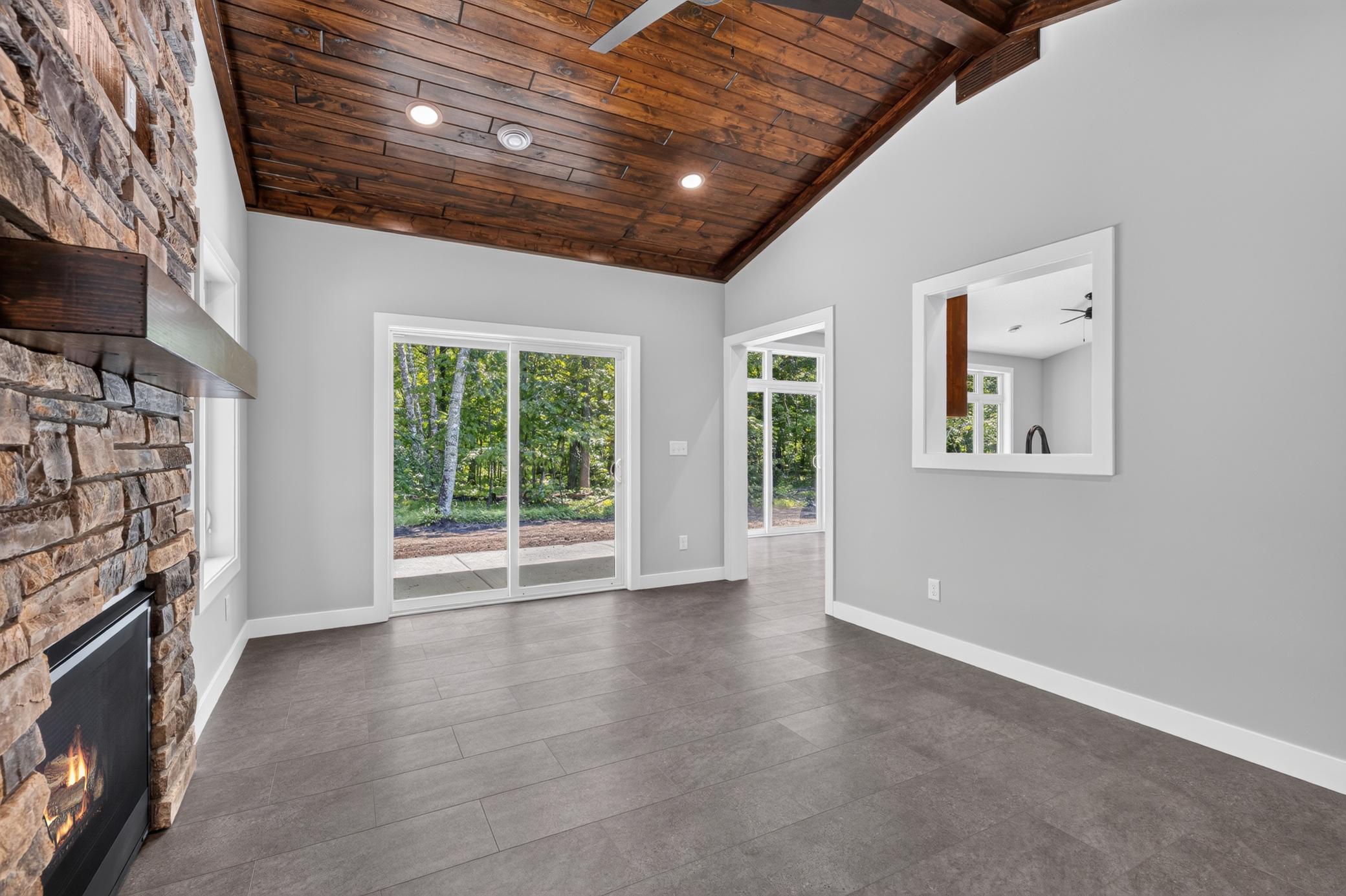 From the Four Season Porch you can easily access the patio. You will also love the custom touch of the open view into the kitchen