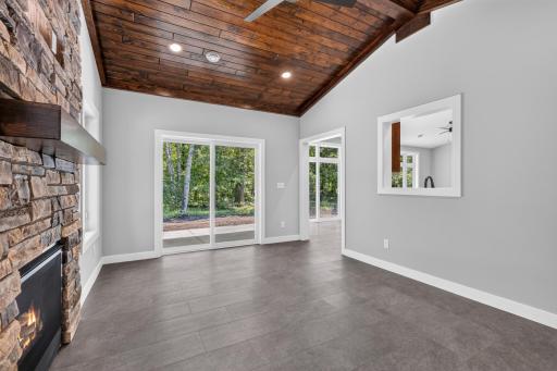 From the Four Season Porch you can easily access the patio. You will also love the custom touch of the open view into the kitchen