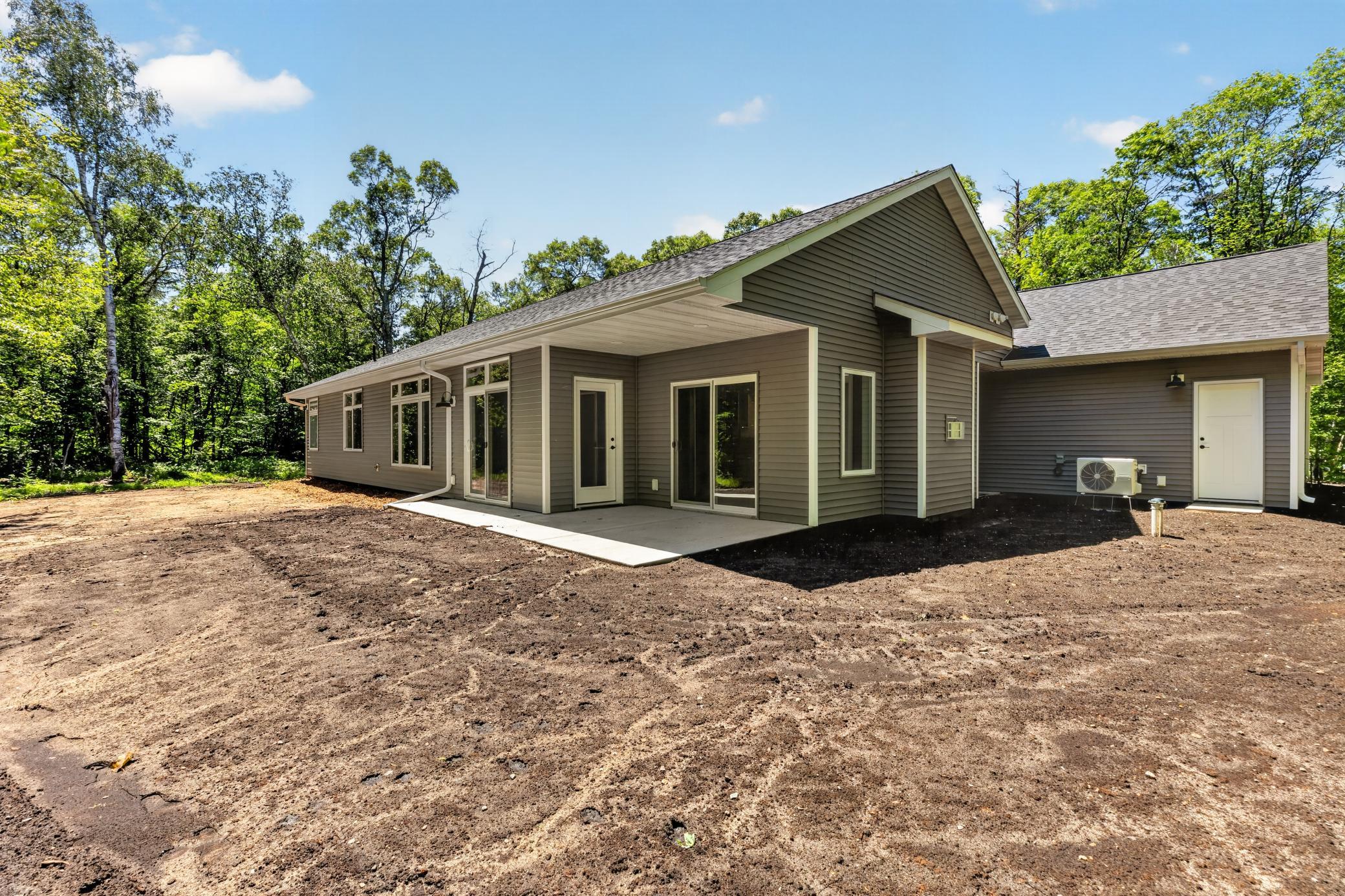 Covered patio that can be accessed from the dining room as well as the Four Season Porch. Perfect area for grilling or relaxing