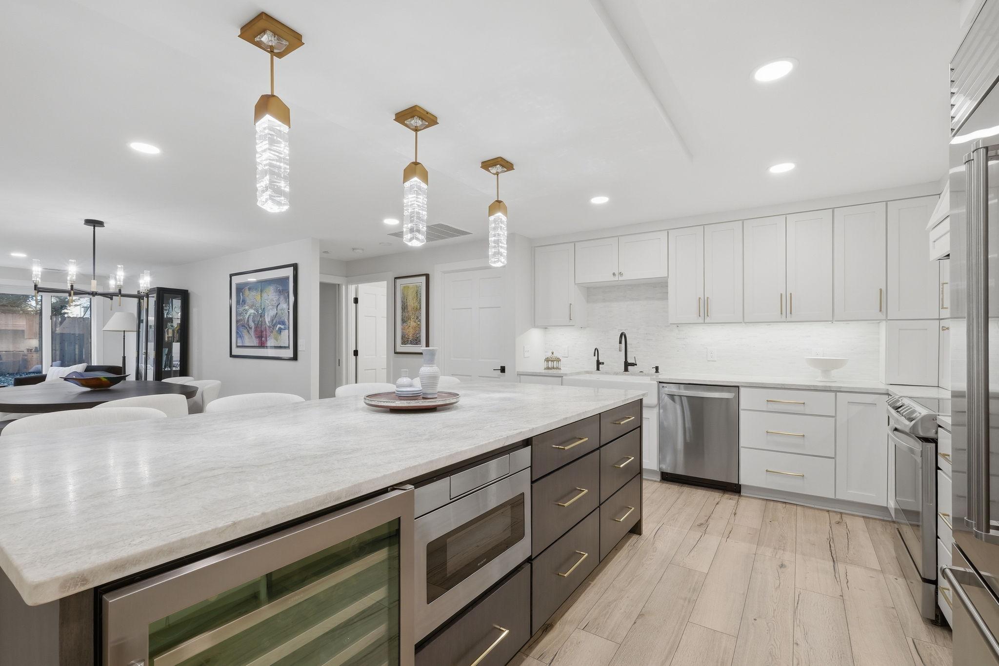 The under-counter drawer microwave and wine cooler on add to this elegant space