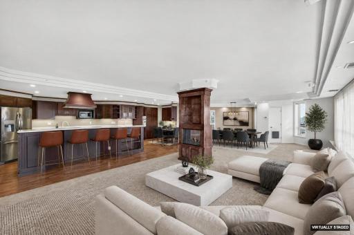Open floor plan creates so many spaces for gathering and entertaining. Virtually staged.
