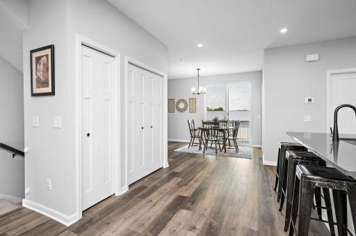 View from kitchen to Dining room with access to a private maintenance free deck to private back yard!
