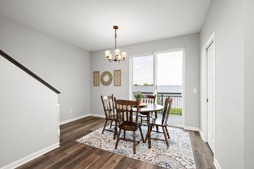Dining room with access to a private maintenance free deck to private back yard!