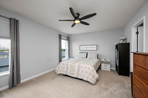 Large primary/owner's suite with a walk-in closet, new ceiling fan and private full bathroom!