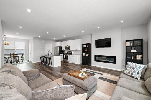 View from Main Floor Living Room to Kitchen with electric fireplace!