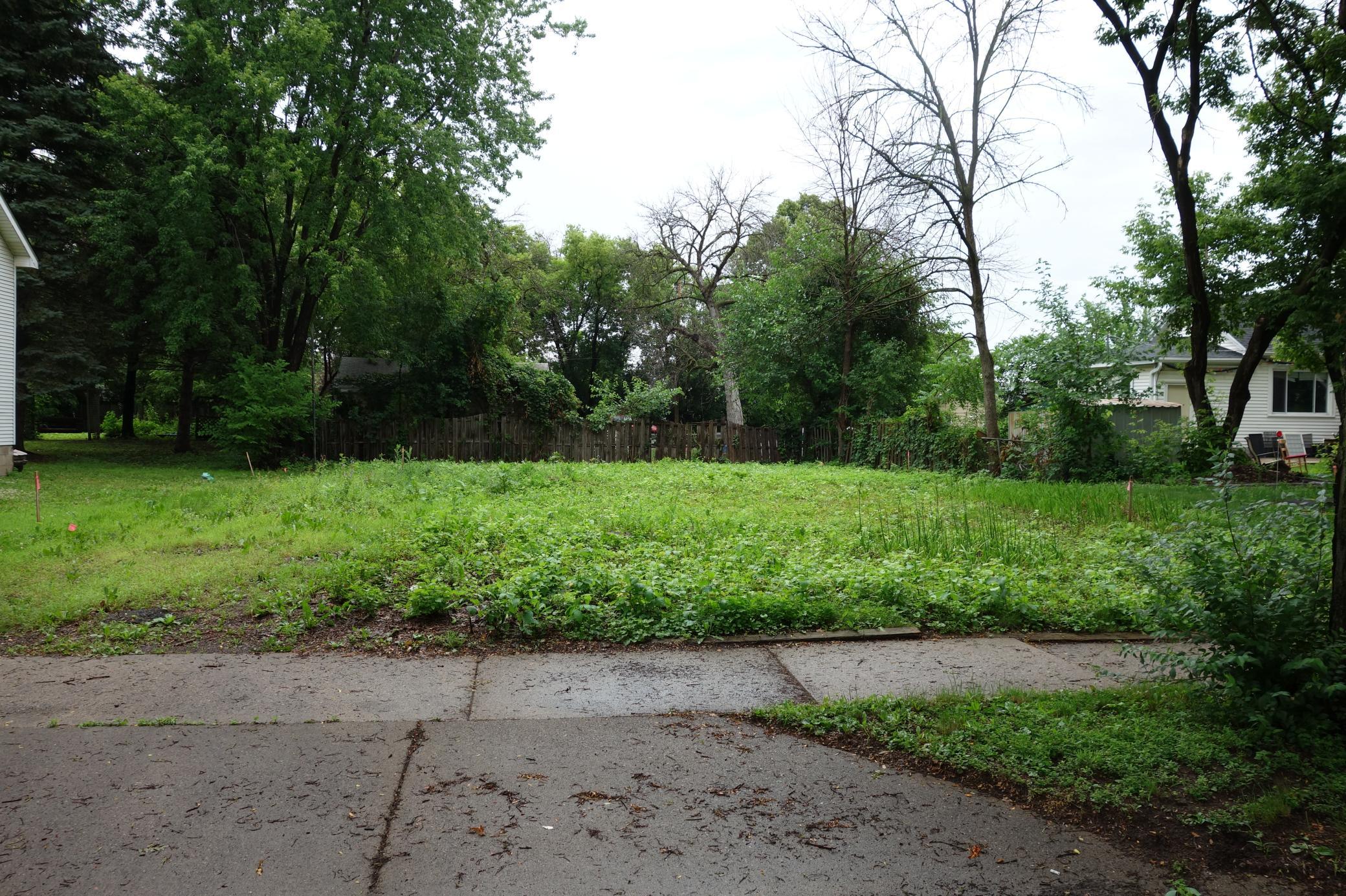 Curb and gutter exists and driveway has been cut in