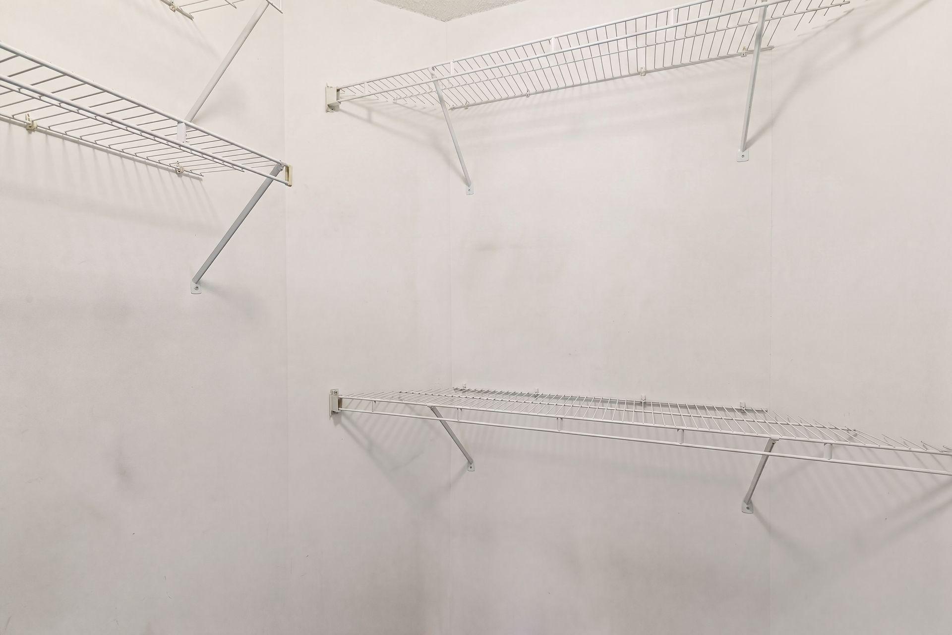 Primary bedroom walk-in closet
