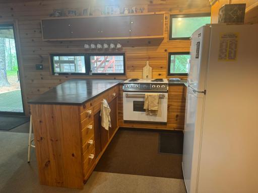 Streamlined cabinetry and built-in shelving keep essentials close at hand, while the open layout flows effortlessly into the living areaâideal for sharing meals & laughter
