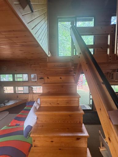 Step into timeless craftsmanship with our beautifully designed solid wood staircase, a true centerpiece of the cabin. Each step is crafted from rich, natural timber, showcasing unique grain patterns and warm tones that bring the outdoors inside.