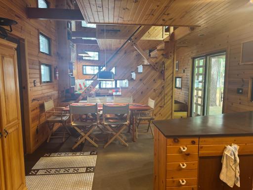 Step into the warmth and charm of this beautifully designed open-concept cabin, where rustic character meets modern comfort. The heart of the home features a seamless flow between the living room, dining area, and kitchen, creating an inviting space