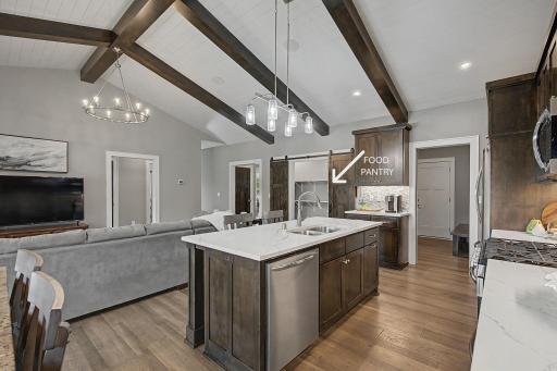 Behind that beautiful track door is a pantry to love!