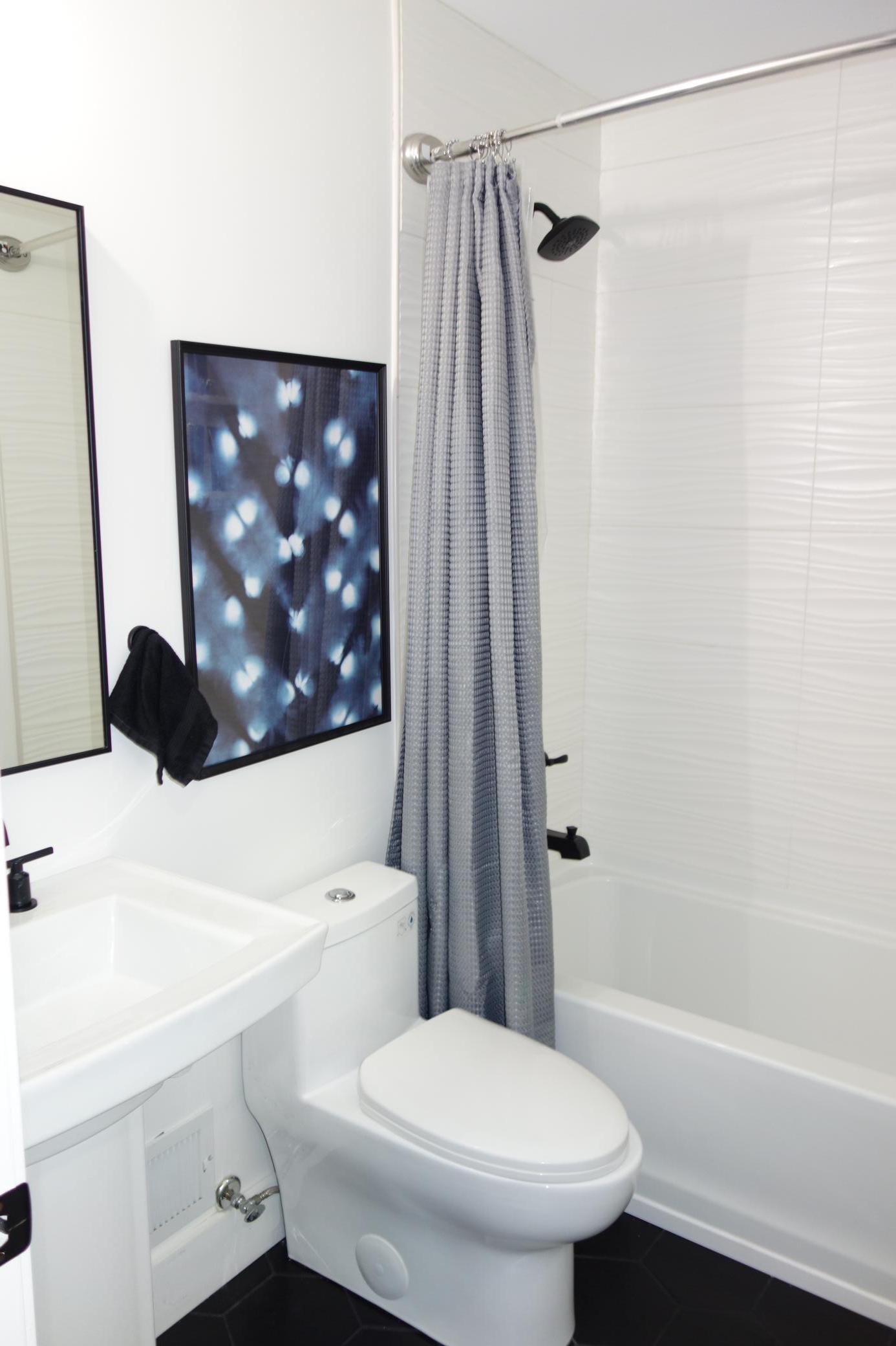 Beautiful main floor full bath with tile shower and floors.