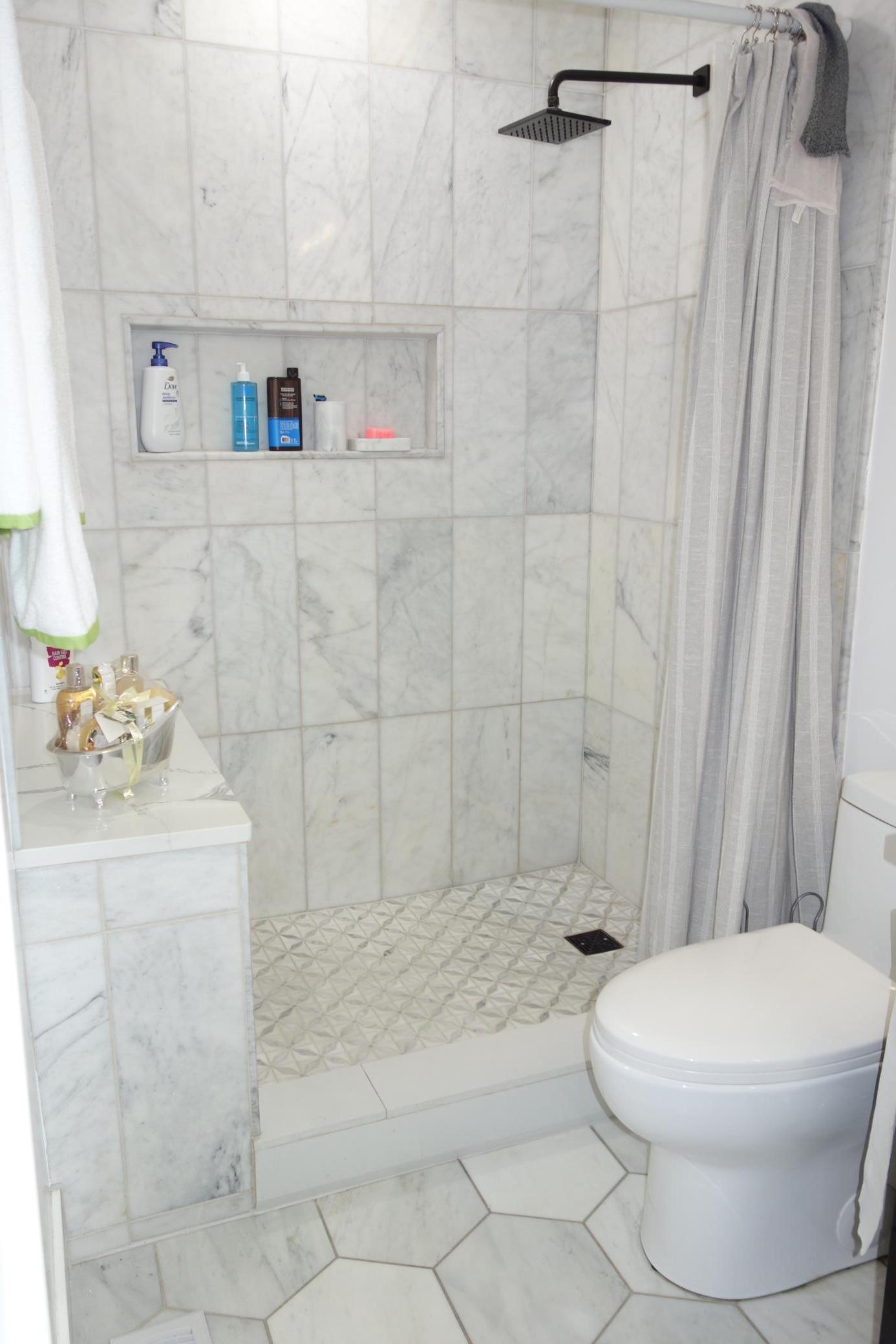 Stunning flooring and shower floor in primary bath.