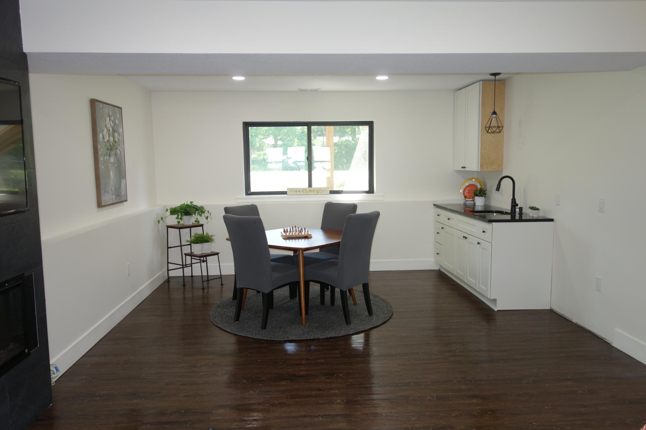 Lower level kitchenette and game room.
