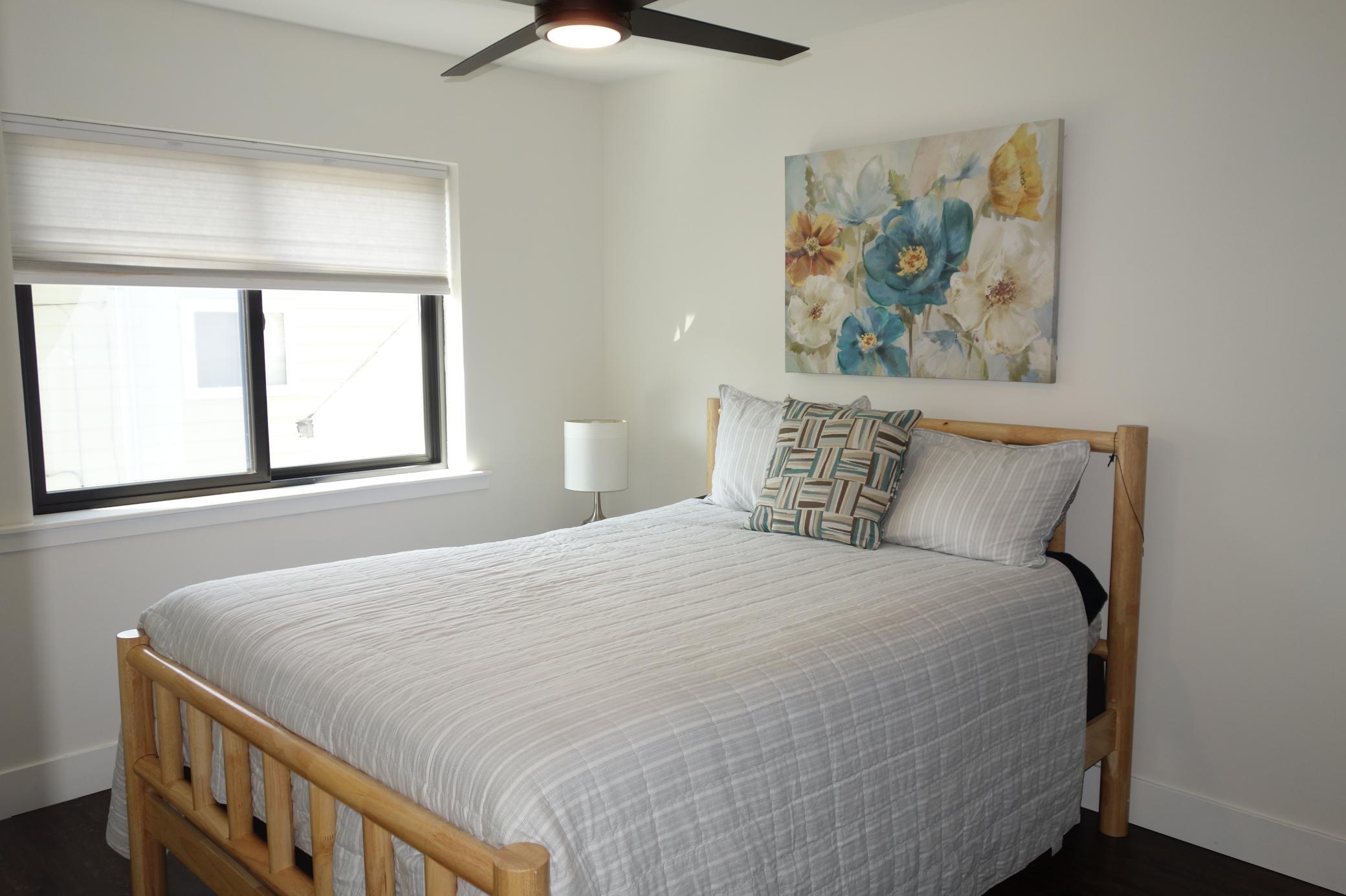 Great lighting and ceiling fan in 2nd bedroom.