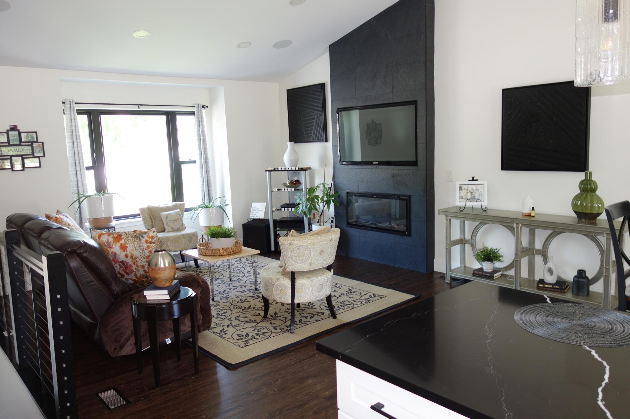 Fireplace accent wall with electric fireplace.