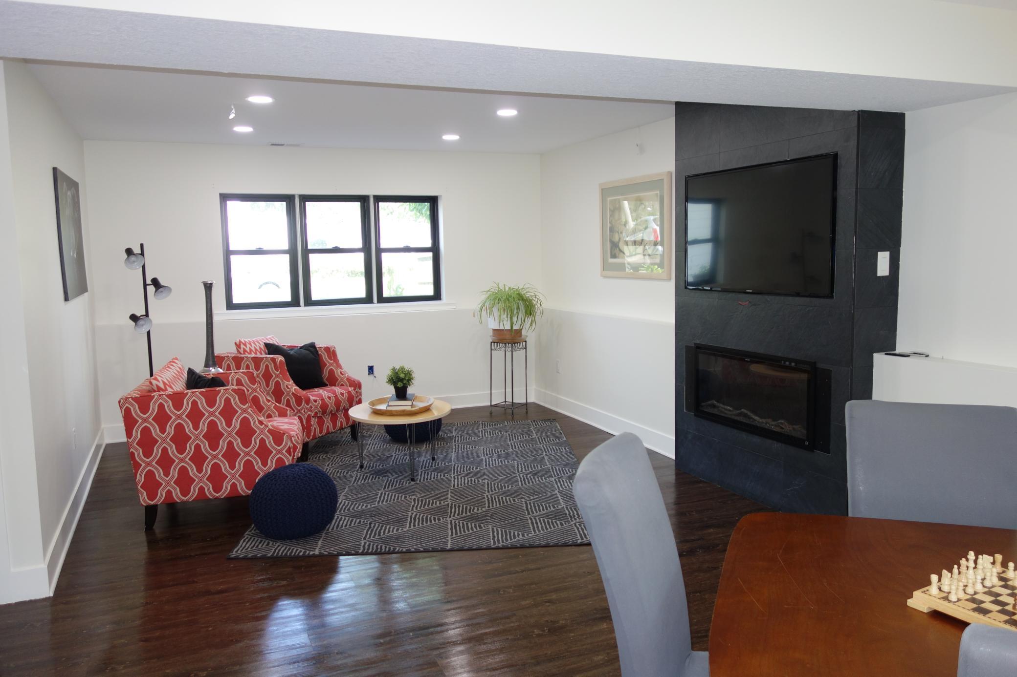 Lower level family room with beautiful fireplace accent wall.