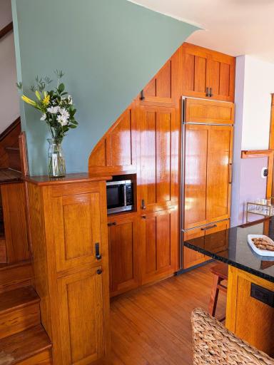 Wall of cabinetry with sub-zero built in refrigerator/freezer
