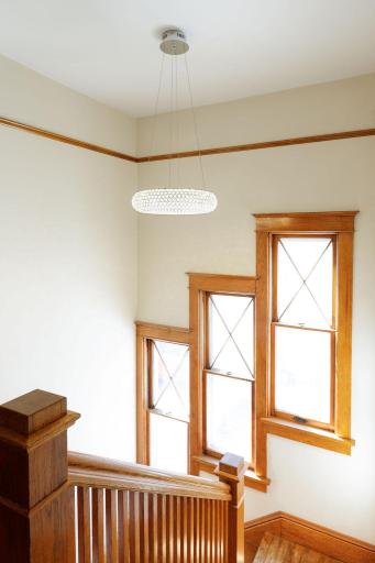 New crystal light fixture above the staircase and triple windows