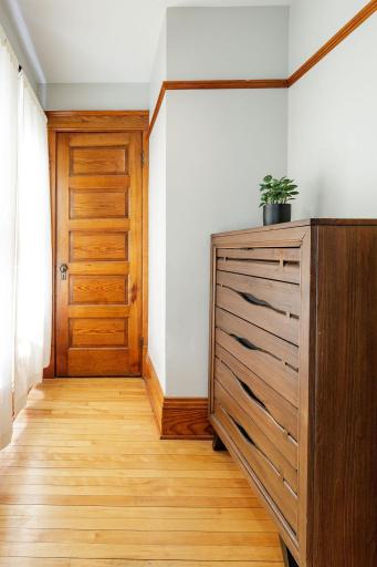 Dressing area and walk in closet for primary bedroom