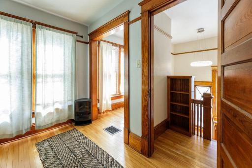 View of the dressing space, bookcase & hallway