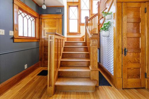 Front staircase with two deep closets on each side
