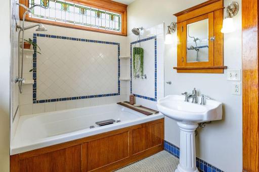 Beautiful stain glass, double pedestal sinks & original medicine cabinets