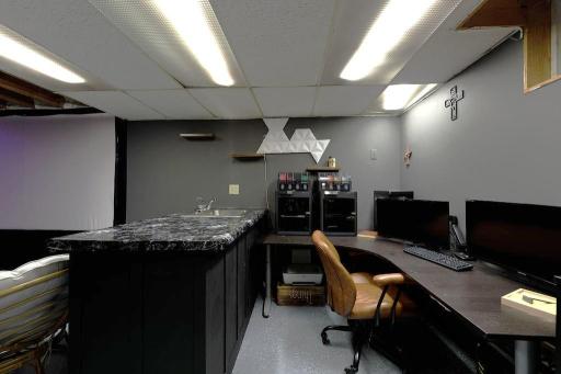 Family room has been incorporated as an office space, wet bar and theater room