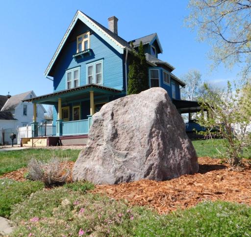 Corner rock and landscaping around the edge of property