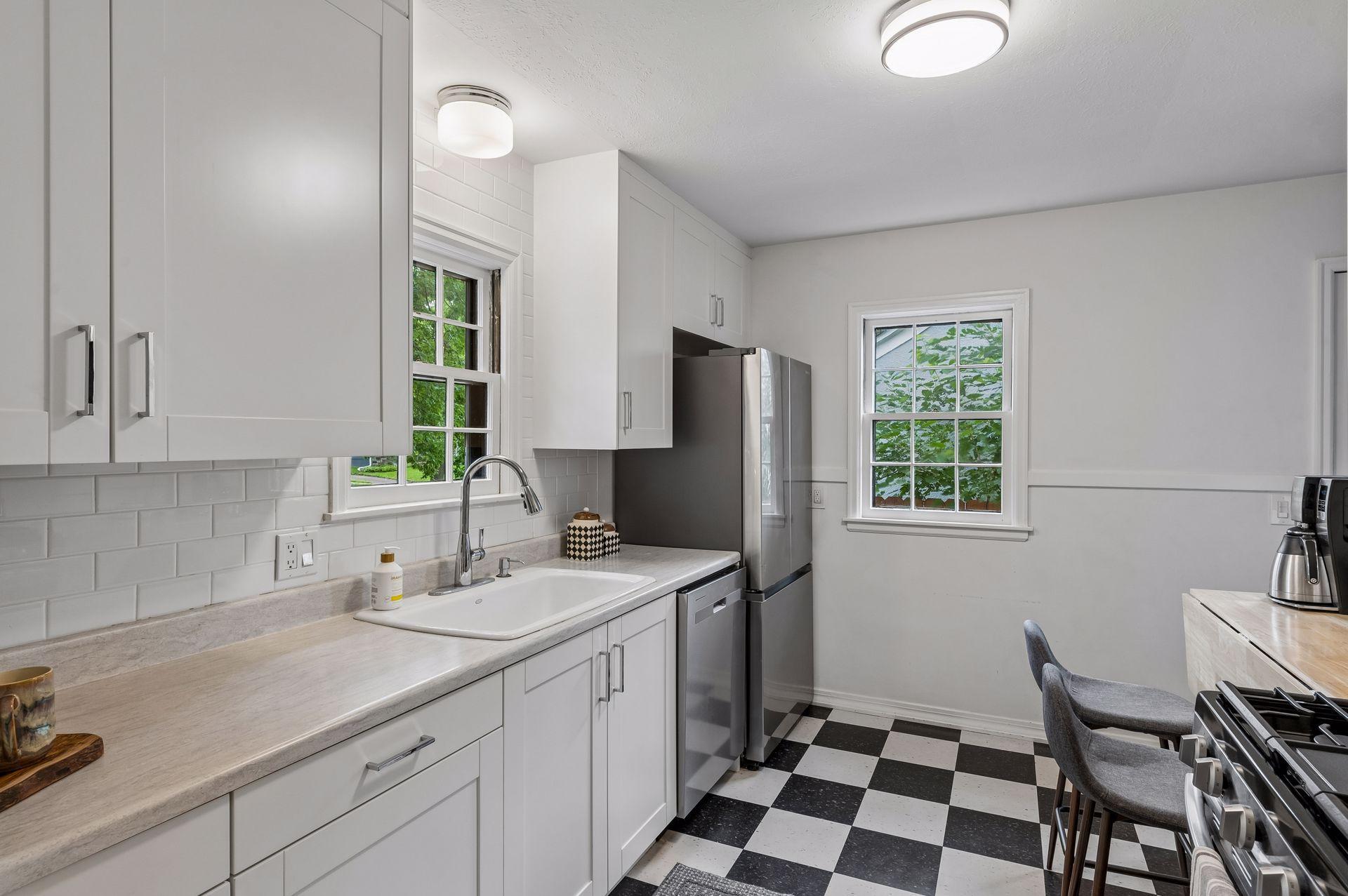 Updated kitchen featuring gas range, stainless steel newer appliances, and soft close cabinets.