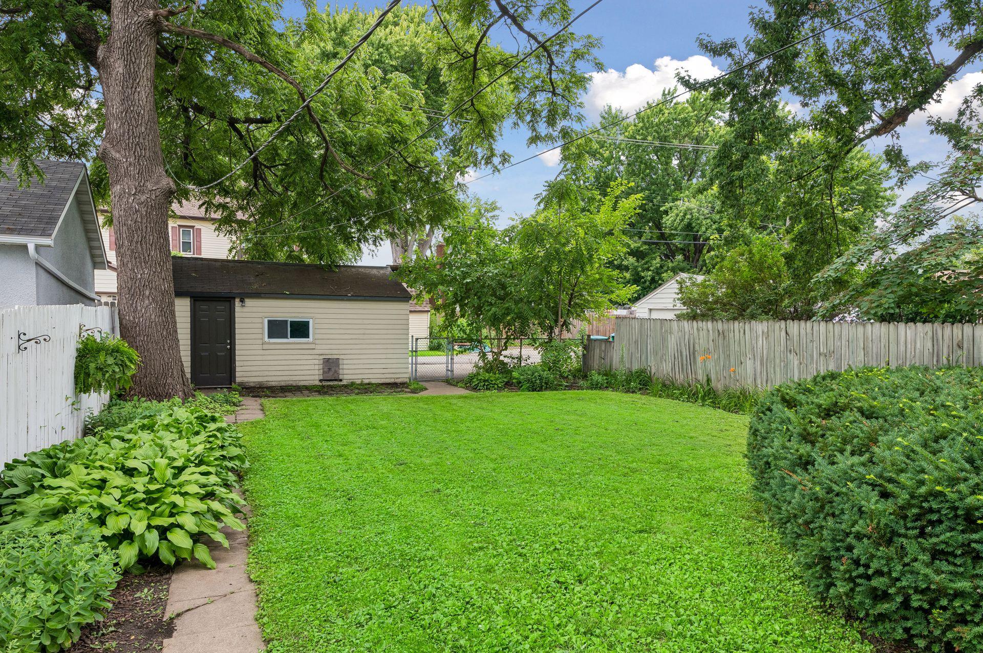Large, fully-fenced, flat backyard.