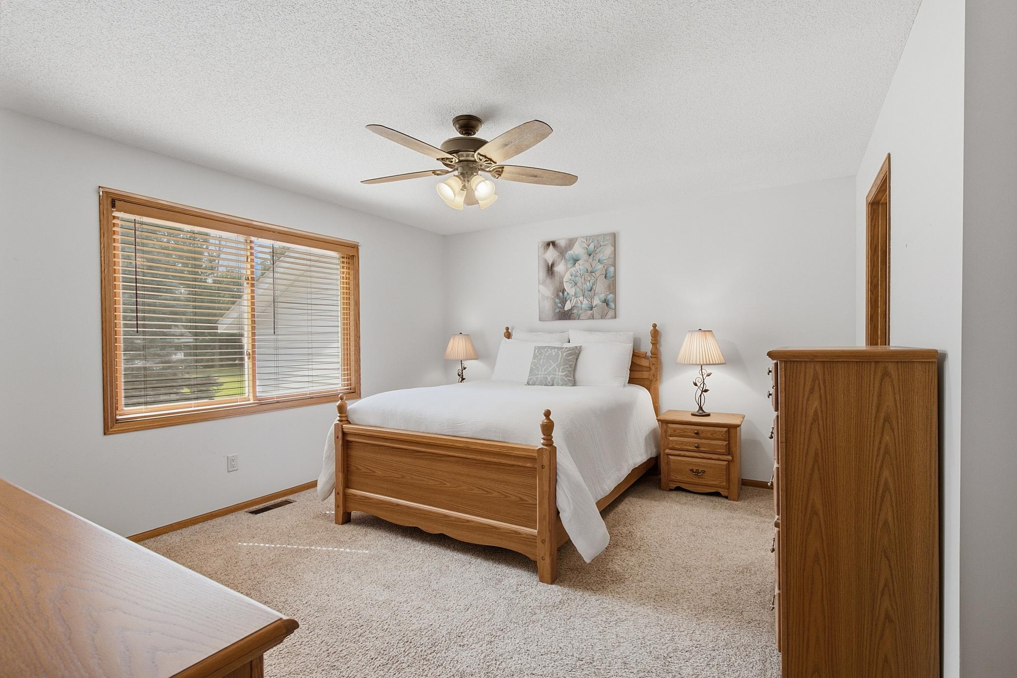 Primary bedroom boasts a private, full bath and a walk in closet.