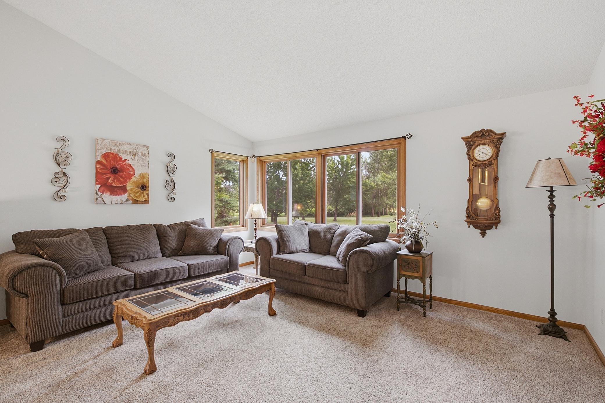 Upper level living room offers huge windows with stunning views of the rear of the property.
