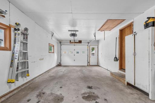 Oversized attached 1 stall garage! Insulated, sheetrocked, and leads into kitchen/dining space.
