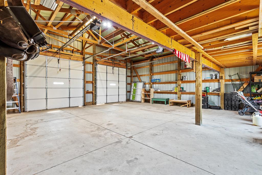 This shop/garage is a dream!! Concrete floors, loft space, oversized doors, and only a few steps from the house. It is hard to find a feature like this in town.
